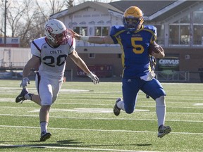 SASKATOON, SASK--OCTOBER 25 2015-Saskatoon Hilltops  quarterback Jared Andreychuk attempts to avoid a tackle from linebacker Colton Burr during the Prairie Football Conference final at SMF Field on Sunday, October 25th, 2015.