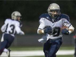 Regina Thunder running back Colton Klassen runs a hand off against the Saskatoon Hilltops during the first half on Saturday, September 5, 2015.