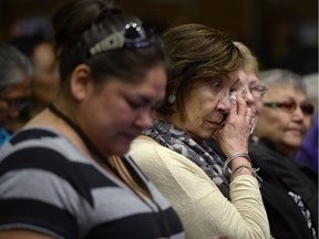 Residential school survivors and aboriginal women react as Truth and Reconciliation Commission chairman Justice Murray Sinclair speaks at the commission in Ottawa on Tuesday, June 2, 2015 in Ottawa.