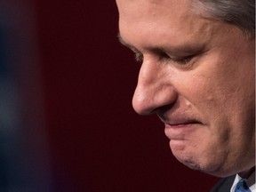 Defeated former prime minister Stephen Harper pauses while addressing supporters in Calgary on election night.