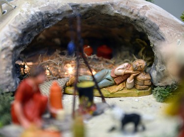A shepherd figurine rests in a cave, a part of a presepio at the home of Orazio Giannini in Regina, Sask. on Sunday Dec. 6, 2015. The model illustrates aspects of the Christmas story, set in an Italian context. Michael Bell/Regina Leader-Post