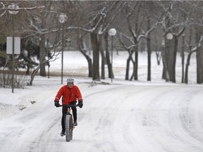 Brian Torgunrud cycles on a road in Wascana Centre in Regina on Dec. 13, 2015.