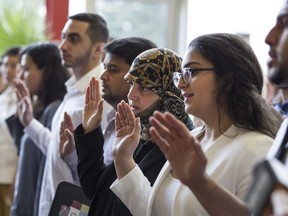 New Canadians are sworn in at a citizenship ceremony in Windsor on July 1.