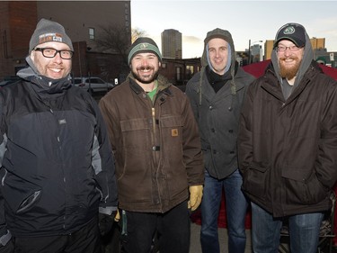 Colin Lea-Wilson, Jeff Lozinsky, Mike Powell and Mathew Kew wait on the sidewalk to buy mead at Bushwakker Brewpub in Regina, Sask. on Saturday Dec. 5, 2015.