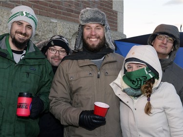 Curtis Mang, Jeremy Foster, Doug Rice, Tanay Hukee, and Clayton C70 wait on the sidewalk to buy mead at Bushwakker Brewpub in Regina, Sask. on Saturday Dec. 5, 2015.