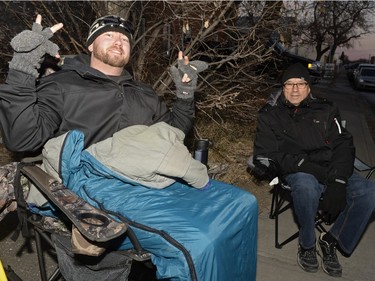 Jason Elmer and Dan Fraser wait on the sidewalk to buy mead at Bushwakker Brewpub in Regina, Sask. on Saturday Dec. 5, 2015.