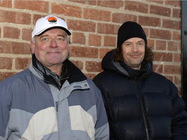 John Szala and Gareth Thompson wait on the sidewalk to buy mead at Bushwakker Brewpub in Regina, Sask. on Saturday Dec. 5, 2015.