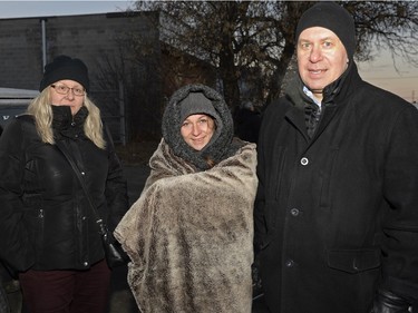 Kathy Wilson, Michelle Halushka, and Robert Baer wait on the sidewalk to buy mead at Bushwakker Brewpub in Regina, Sask. on Saturday Dec. 5, 2015.