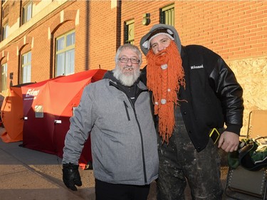 Mark Grosse and Marcel Joyal wait on the sidewalk to buy mead at Bushwakker Brewpub in Regina, Sask. on Saturday Dec. 5, 2015.