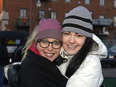 Nicole Bonner and Lindsey Jensen wait on the sidewalk to buy mead at Bushwakker Brewpub in Regina, Sask. on Saturday Dec. 5, 2015.