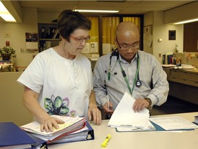 Nurse Debbie Rodger, left, and Dr. Alexander Wong review some charts in the Infectious Diseases Clinic at the General Hospital on Thursday, June 7, 2012.  Rodger just won a national award for recognition in her work for HIV/AIDS in Regina,  June 7, 2012.