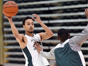 Aaron McGowan (with ball) is settling in with the University of Regina Cougars men's basketball team after transferring to the U of R this year from the University of the Fraser Valley.