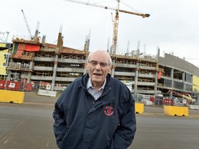 Charlie Wickenheiser, an 88-year-old retired construction worker, is shown with the new Mosaic Stadium in the background in Regina on Dec. 9, 2015.