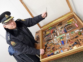 Director of court security Ralph Martin alongside items seized in the course of court security screening at Regina Provincial Court on December 16, 2015.