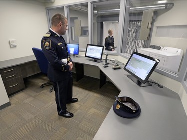 Ian Brooks, left, and Jennifer Brand, both staff training officer with Correctional Services Canada, tour media through the tour the new Correctional Service of Canada training academy located on RCMP Depot in Regina on Wednesday.