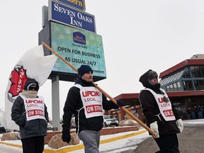 Pickets in front of Best Western Seven Oaks on Dec. 28, 2015. The union says contract talks broke down over wage issues, while hotel management says the divisive issue was over the union's access to the hotel.