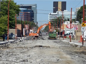 City road crews tear up and rebuild 11th Avenue between Broad Street and Winnipeg Street on June 26, 2015.
