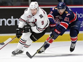REGINA SK: NOVEMBER 13, 2015 -- Conner Bleackley (L) with the Red Deer Rebels and Jared McAmmond (R) with the Regina Pats battle for the puck during a WHL game at the Brandt Centre in Regina, SK on November 13, 2015.  (DON HEALY/Regina Leader-Post) (Story by Greg Harder) (SPORTS)