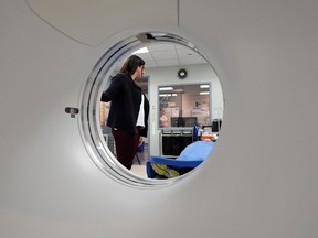 Dr. Andrea Gourgaris, a radiologist at Radiology Associates of Regina, demonstrates a CT scanner.