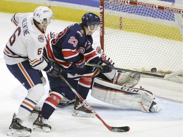 Pats Sam Steel 23 is pressured by Blazers Dallas Valentine during WHL action between the Regina Pats and the Kamloops Blazers at the Brandt Centre.