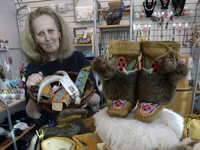 Connie Mcleod with FN beadwork is currently selling for a family who once owned a fishing camp in northern Saskatchewan. There are beaded moccasins, mukluks, vests, jackets and other items in her shop at the Regina International Airport in Regina December 8, 2015.