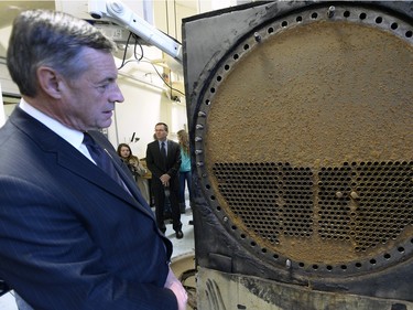 Education Minister Don Morgan takes a look at some of the historical objects.