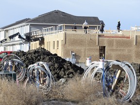 The pace of housing starts,more than doubled in November, with 207 total starts compared with 93 during the same period in 2014, Canada Mortgage and Housing Corp. (CMHC) said Tuesday. Most of the increase was in multiple-unit housing, such as this complex going up in Harbour Landing in southwest Regina,  which increased to 145 units from 47 year over year.