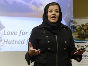Sadia Sami speaks during the #JeSuisHijabi event at the George Bothwell Library in Regina on Dec. 13, 2015. The event was organized by the Ahmadiyya Muslim community, and was an opportunity for the public to ask Muslim women about their faith and identity. The slide behind her says 'Love for All, Hatred for None.'