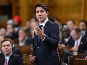 Prime Minister Justin Trudeau answers a question in Question Period in the House of Commons in Ottawa, on Monday, Dec. 7, 2015.