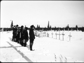 Residential school students at Fort George cemetery, Quebec in 1946.