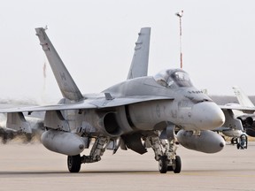 A pilot positions a CF-18 Hornet at CFB Cold Lake, Alberta on Oct. 21, 2014. The CF-18s were making their way to Kuwait, to join the fight against ISIS.