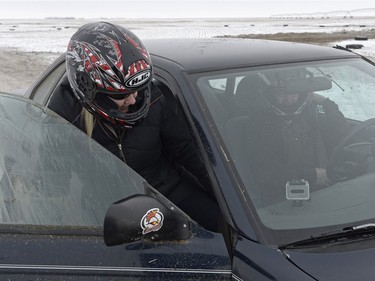 Amanda Jacek-Flaman, left, and her husband Russell prepare to race at Winter Rally X south of Regina, Sask. on Sunday January 24, 2016.