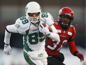 Defensive back Derrius Brooks, shown in 2013 file photo chasing receiver Chris Getzlaf, signed with the Saskatchewan Roughriders on Monday