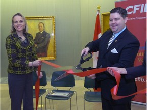 Then-enterprise minister Jeremy Harrison and Canadian Federation of Independent Business vice-president Marilyn Braun-Pollon launch Red Tape Awareness week in this 2012 file photo. Saskatchewan got a B grade in 2015 and 2016 for its efforts to cut red tape for the province's small business.