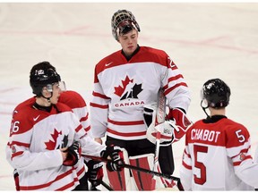 Canada's goalie Mackenzie Blackwood, centre, reacts to his team's loss against Finland following quarter-final hockey action at the IIHF World Junior Championship, in Helsinki, Finland, on Saturday, Jan. 2, 2016.