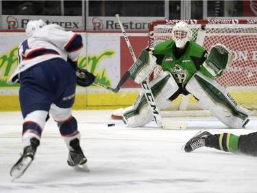 Regina Pats forward Jared McAmmond (#21) scores on Prince Albert Raiders goalie Rylan Parenteau (#30) during a game held at the Brandt Centre in Regina on Sunday January 3, 2016.