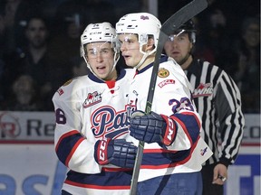 Regina Pats forwards Cole Sanford, left, and Sam Steel celebrate a goal against the Prince Albert Raiders at the Brandt Centre on Saturday.
