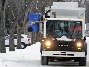 A recycling truck picks up waste in Regina.