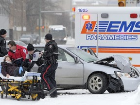 Regina EMS workers and police at the scene of a collision.