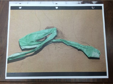 A reproduction of a photo entered as an exhibit at the Goforth trial. It shows green painter's tape with strands of hair found in the basement of the Regina home where the Tammy and Kevin Goforth resided.
