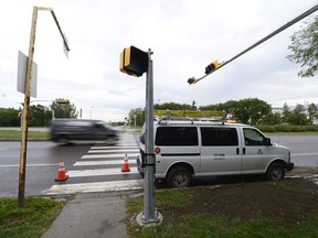 A new set of traffic lights being installed on the corner of Wascana Parkway and University Drive North in Regina.