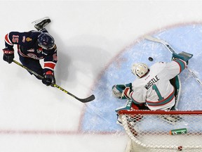The Regina Pats' Sean Richards, left, shown trying to score on Kelowna Rockets goaltender Jackson Whistle earlier this season, has been elevated to one of his team's top lines along Sam Steel and Cole Sanford.