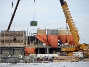 Crews home on multi-unit housing in Harbour Landing in Regina earlier this week. Regina saw the largest decline in new housing prices among 21 Canadian cities in November, according to Statistics Canada.