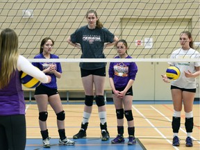 Miranda Weber, who is 6-foot-11, is shown with her teammates during a recent practice with the Queen City Volleyball Club's U17 Black team.