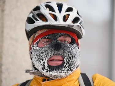 Reaud Bonneville rides through downtown Regina in -20.2°C temperatures with a windchill temperature of -33°C on his way to work on Monday, January 18, 2016.