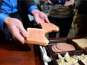 Drew Wilby, with Saskatchewan Corrections, displays a lunch meal prepared for inmates at the Regina Provincial Correctional Centre.