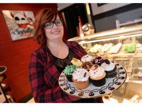 Natasha Salter, co-owner of Sinfully Sweet Cathedral Bakery, holds up  samples of sweets that will be available for tasting on Jan. 30 at Taste of Cathedral, a fundraiser that supports the Cathedral Village Arts Festival.