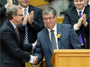Premier Brad Wall (left) and former finance minister Ken Krawetz were all smiles when the provincial budget was handed down last March, but oil prices have since slumped and hurt the government's bottom line.