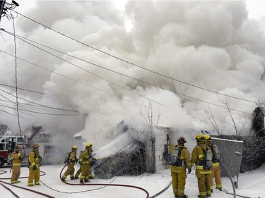 REGINA,Sk: JANUARY 20, 2016 -- Regina Fire and Protective Services were called to a stubborn garage fire on the 1400 block Retallack Street Wednesday afternoon. BRYAN SCHLOSSER/Regina Leader-Post