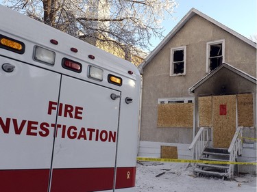 Police and Fire investigators at a home on the 1700 block Toronto Street that was the scene of two fires in one week.